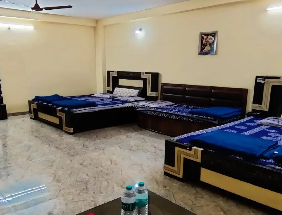 Family room with two double beds and soft lighting